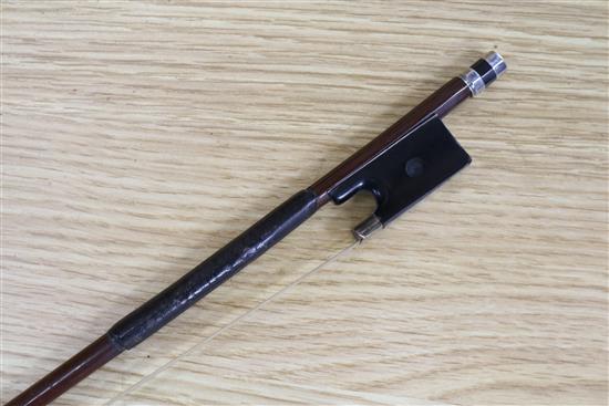 A silver mounted violin bow, an ivory mounted violin bow and a late 19th century German violin, cased